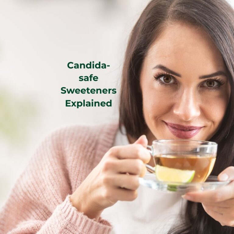 a woman about to sip a cup of tea with the words candida-safe sweeteners explained beside her.