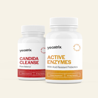 Two white bottles with labels: "Yeastrix Candida Cleanse" and "Yeastrix Active Enzymes" against a light background.