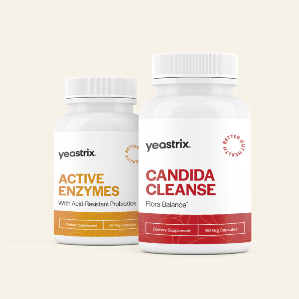 Two bottles of dietary supplements. The left bottle is labeled "Active Enzymes" and the right bottle is labeled "Candida Cleanse." Both have "yeastrix" branding.