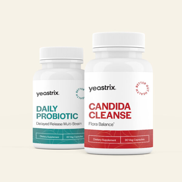 Pill-Bottle-Mockup CC+DP Two white bottles of Yeastrix supplements: Daily Probiotic on the left and Candida Cleanse on the right, placed against a light background.