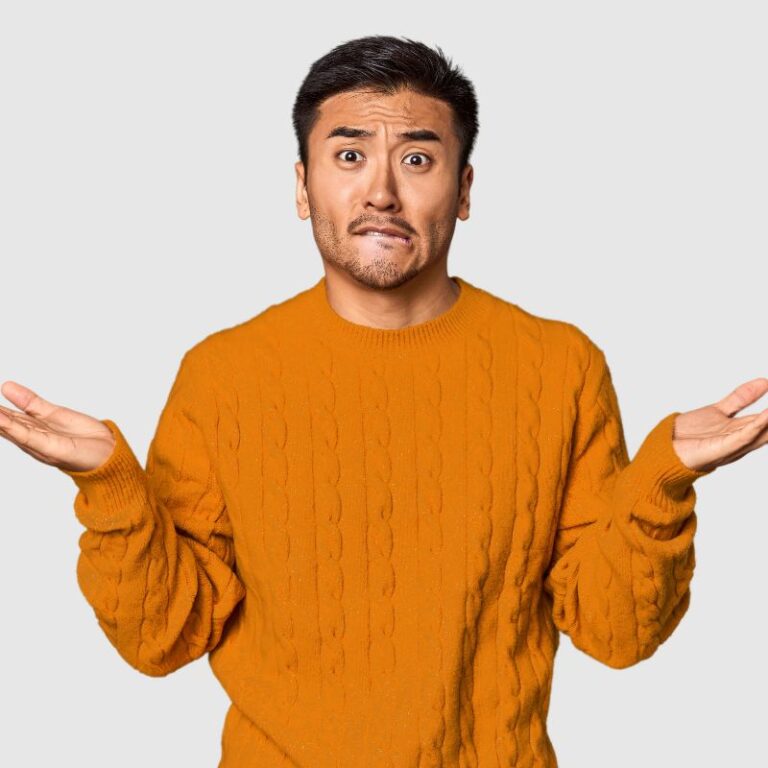 young asian man with confused look on face possibly experiencing candida brain fog