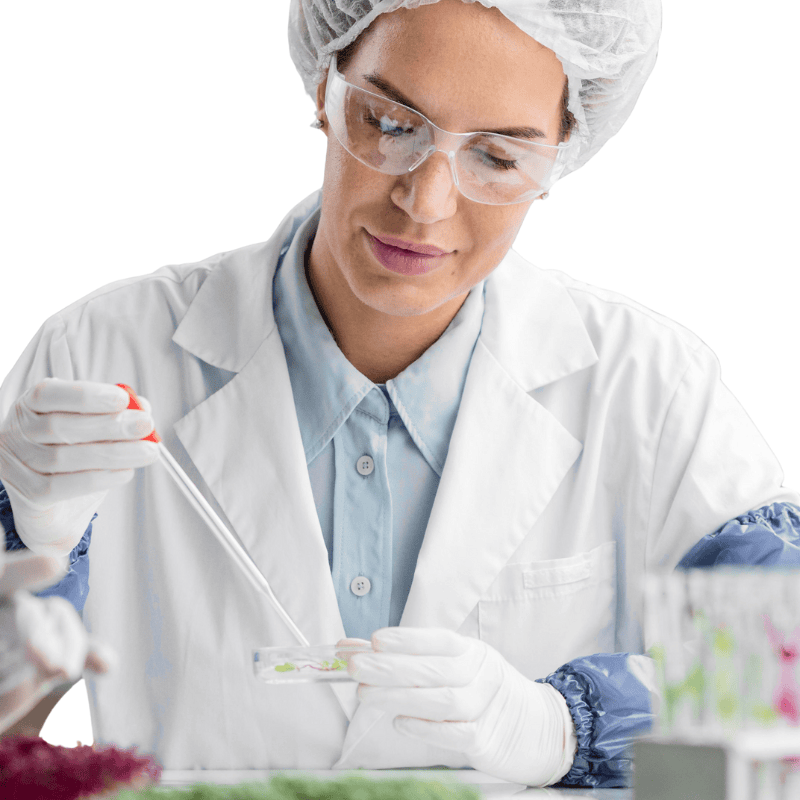 woman in lab coat and hair net making mold derived enzymes in supplements