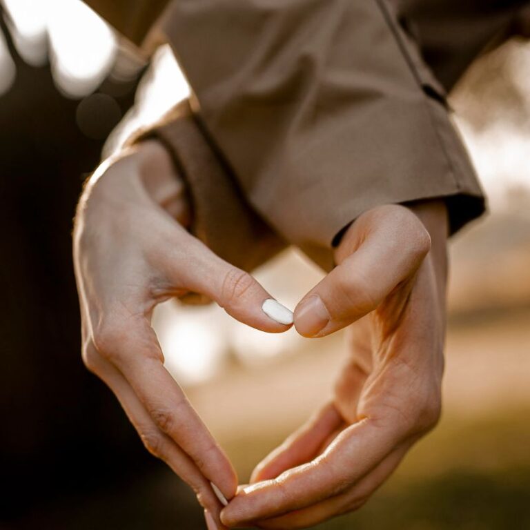 a photo of two hands making the shape of a heart to represent the question can you have sex with a yeast infection