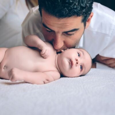 man kissing young baby - breastfeeding and gut health - love is the best