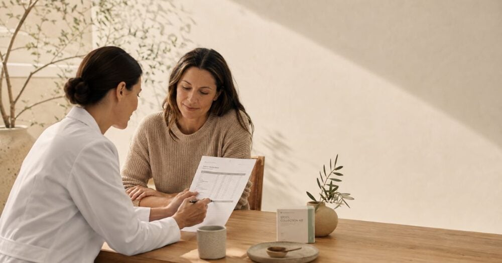 Naturopath discussing Candida test results with a patient during a healthcare consultation.